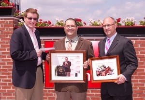 Maryland Jockey Club president Tom Chuckas (left) and Vice President-Communications Mike Gathagan (right) present Frank Carulli with parting gifts.  Photo by Jim McCue, Maryland Jockey Club.