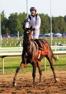 Forest Boyce exults after winning the G3 Virginia Oaks.  Photo by Nick Hahn.