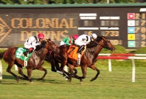 Forest Boyce, aboard Nellie Cashman, upset the Virginia Oaks in 2013.  Photo by Nick Hahn.