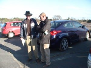 Trainer Ollie Figgins, right, talks with Ted Black of The Racing Biz at Bowie on Friday morning.