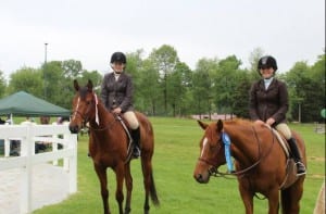 All in the family.  Emilie, left, and Kelsie Figgins have inherited their family's love of horses.  Photo courtesy of Ollie Figgins, III.