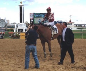 This could get to be a habit.  Chris Grove, in blazer, leads Celtic Katie into the winner's circle after she took Saturday's Geisha Stakes at Pimlico. It was Grove's fifth Geisha win.