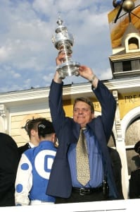 John Servis celebrates Smarty Jones's 2004 Preakness win.  Photo by Jim McCue, Maryland Jockey Club.