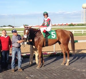 Winning his second Pennsylvania Governor's Cup was no sweat for Tightend Touchdown and assistant trainer Henry Argueta, in red.