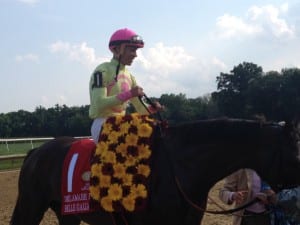 Jose Ortiz is all smiles after Belle Gallantey upset the Delaware Handicap. Photo by The Racing Biz.