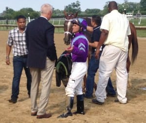 Jockey Javier Castellano and trainer Todd Pletcher (blue blazer) discuss Princess of Sylmar's defeat. Photo by The Racing Biz.