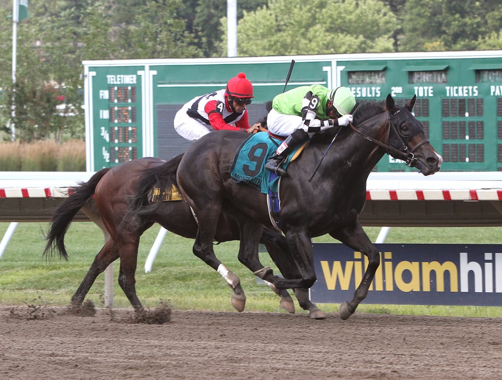 Valid inches past Bradester in the Monmouth Cup. Photo By Ryan Denver/EQUI-PHOTO.