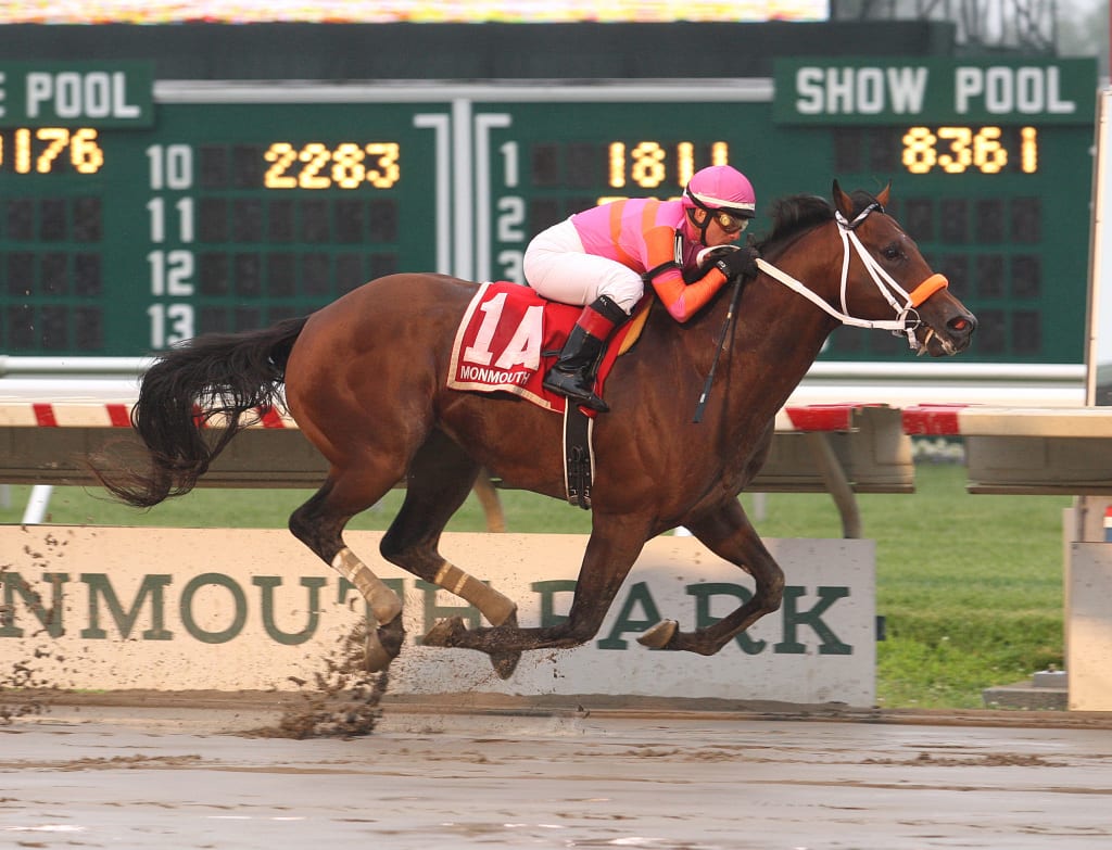 Bern Identity and Paco Lopez roll through the gloaming to win the My Frenchman at Monmouth.  Photo By Bill Denver/EQUI-PHOTO