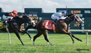 Divine Oath, with Jose Caraballo up, takes the Kent Stakes at Delaware Park. Photo by HoofprintsInc.com.