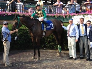 Eriluis Vaz and trainer Eddie Graham (in tie) celebrate Hardest Core's Cape Henlopen victory.