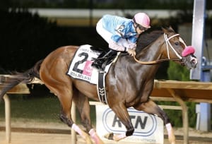 Miss Behaviour takes the Grade 3 Charles Town Oaks. Photo by Jeff Brammer.