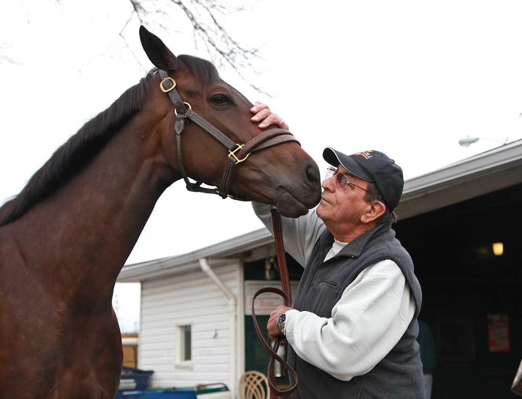 Trainer John Mazza gives a kiss to the nose of Stiffed, a 4-year-old New Jersey-bred filly, on April 13. Photo By Bill Denver/EQUI-PHOTO. 