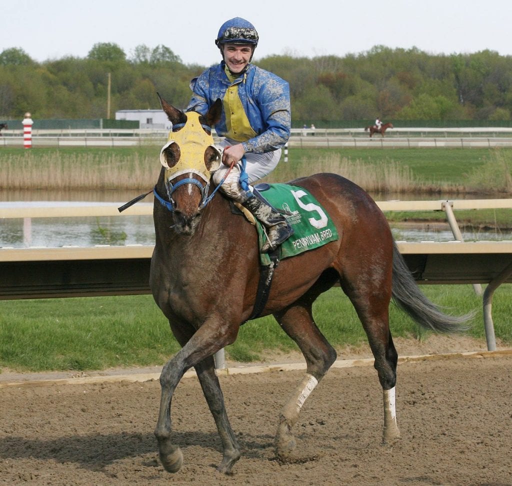 Jockey Matt Rispoli was all smiles after winning the Foxy J. G. aboard Power of Snunner. Photo by Barbara Weidl / Equi-Photo.