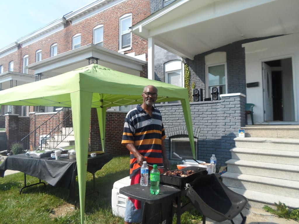 Mike Burnett cooking up some of the up to 50 pounds of chicken he'll make on Preakness day. Photo by Teresa Genaro.