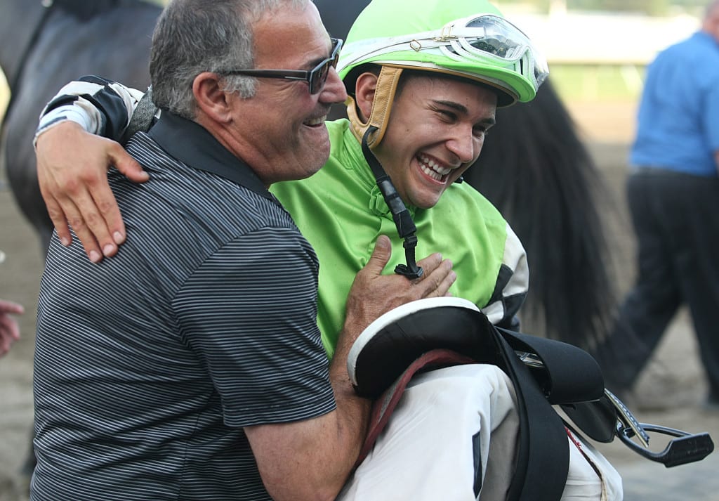 Trainer Marcus Vitali (L) and Jockey Nik Juarez celebrate after Juarez guided the Vitali trained Valid to victory in the $150,000 Philip H. Iselin Stakes. It was the first stakes win for Juarez. Photo By Bill Denver/EQUI-PHOTO