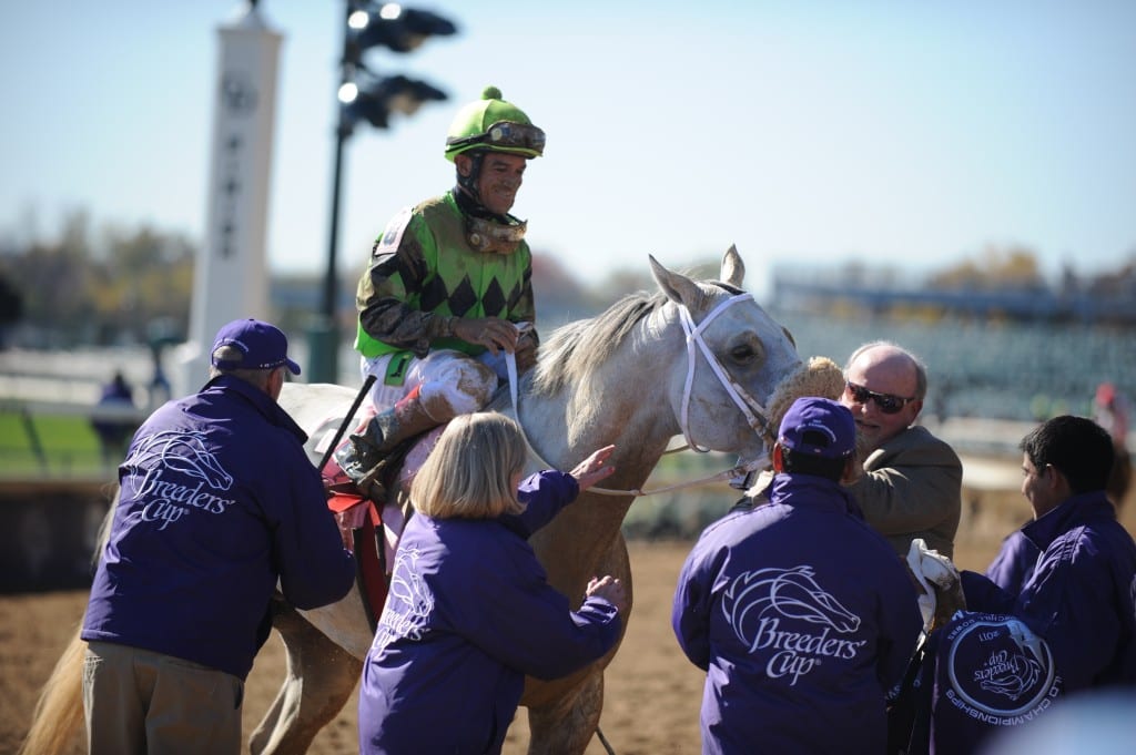 Butch Reid (second from right, in tan) greets Breeders' Cup Marathon winner Afleet Again. Photo by © Breeders' Cup/Weasie Gaines 2011