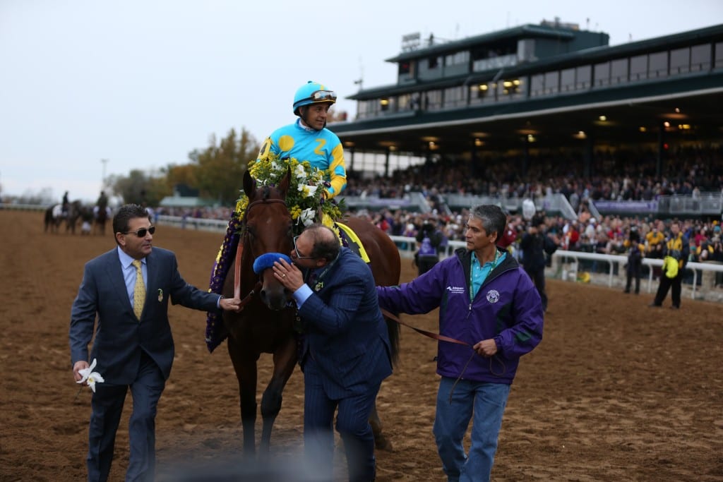 A kiss for the champ from owner Ahmed Zayat. Photo by © Breeders' Cup/Tyger Williams 2015