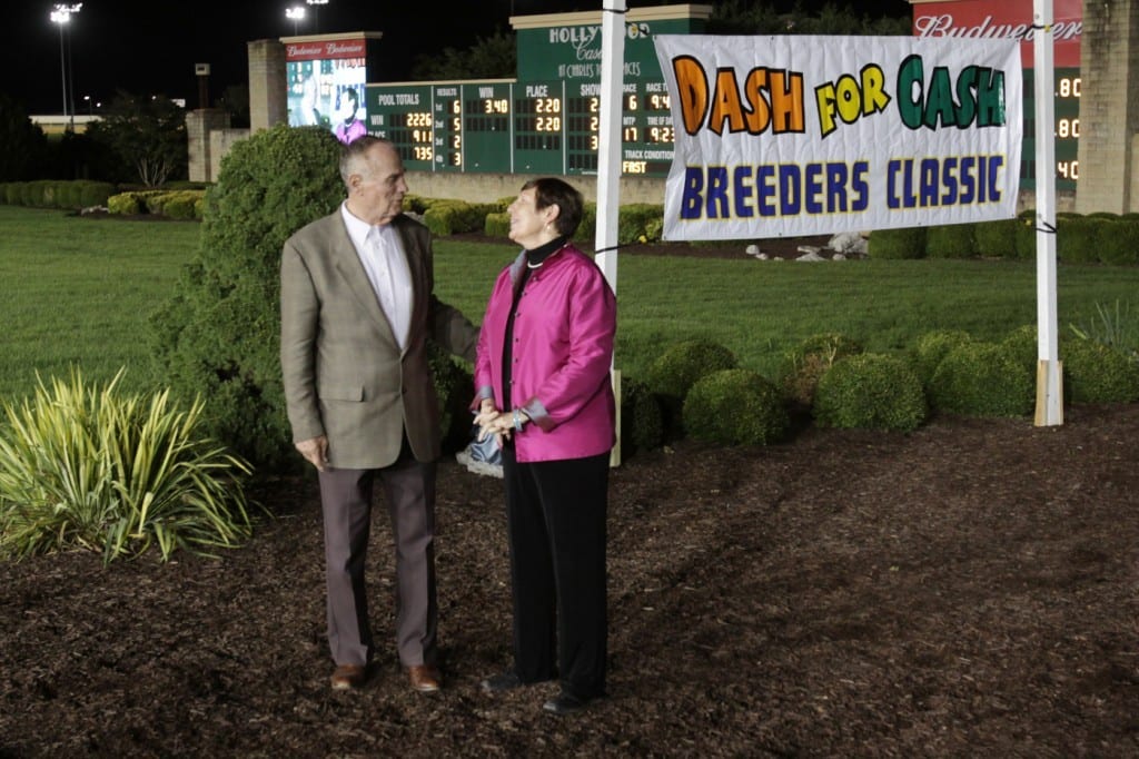 Trackside hosts and founders Sam Huff and Carol Holden share a moment at the 2015 West Virginia Breeders Classics. Photo by Coady Photography.