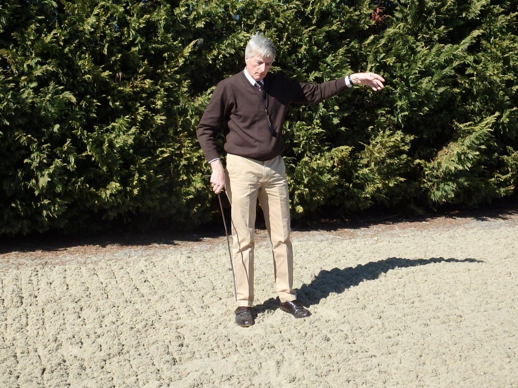 Michael Dickinson probes the Tapeta training track at Tapeta Farm. Photo by The Racing Biz.