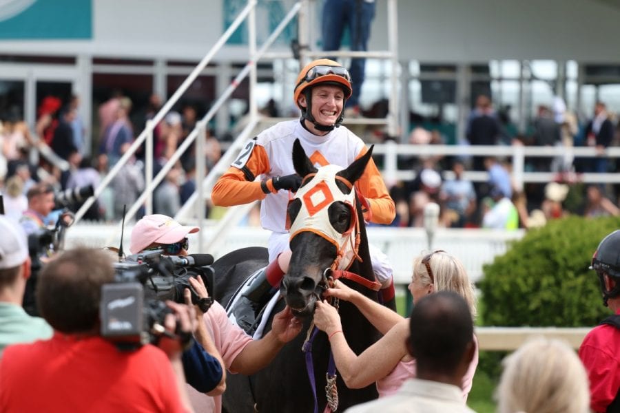 Trevor McCarthy all smiles aboard Ben's Cat. Photo by George Adams.