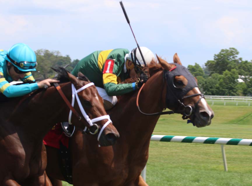 Just Howard (inside) held off Bonus Points to win the Caveat Stakes. Photo by Laurie Asseo.