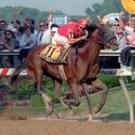 Jockey Somsanith, 50, wins first race since 2014