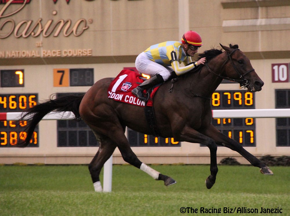 Moon Colony and Julien Leparoux slipped through inside and proved best in the Grade 2 Penn Mile. Photo by Allison Janezic.