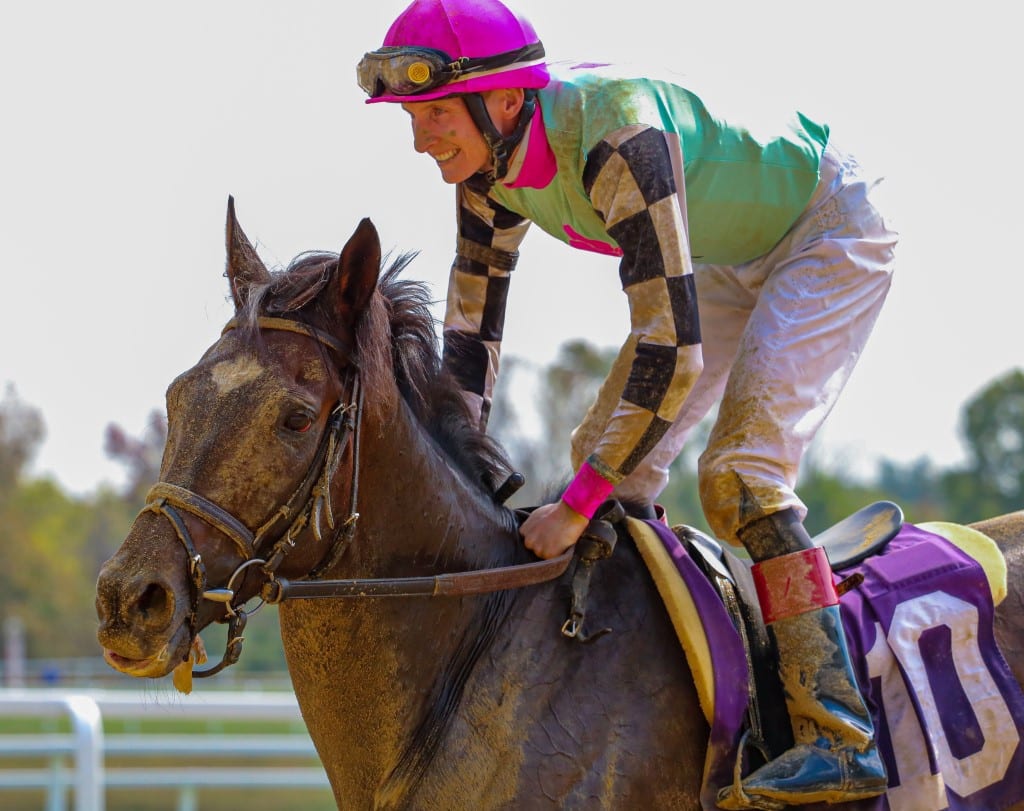 Trevor McCarthy (here, with Tiz He the One) had plenty of reason to smile after winning four stakes races Saturday at Laurel Park. Photo by Dottie Miller.