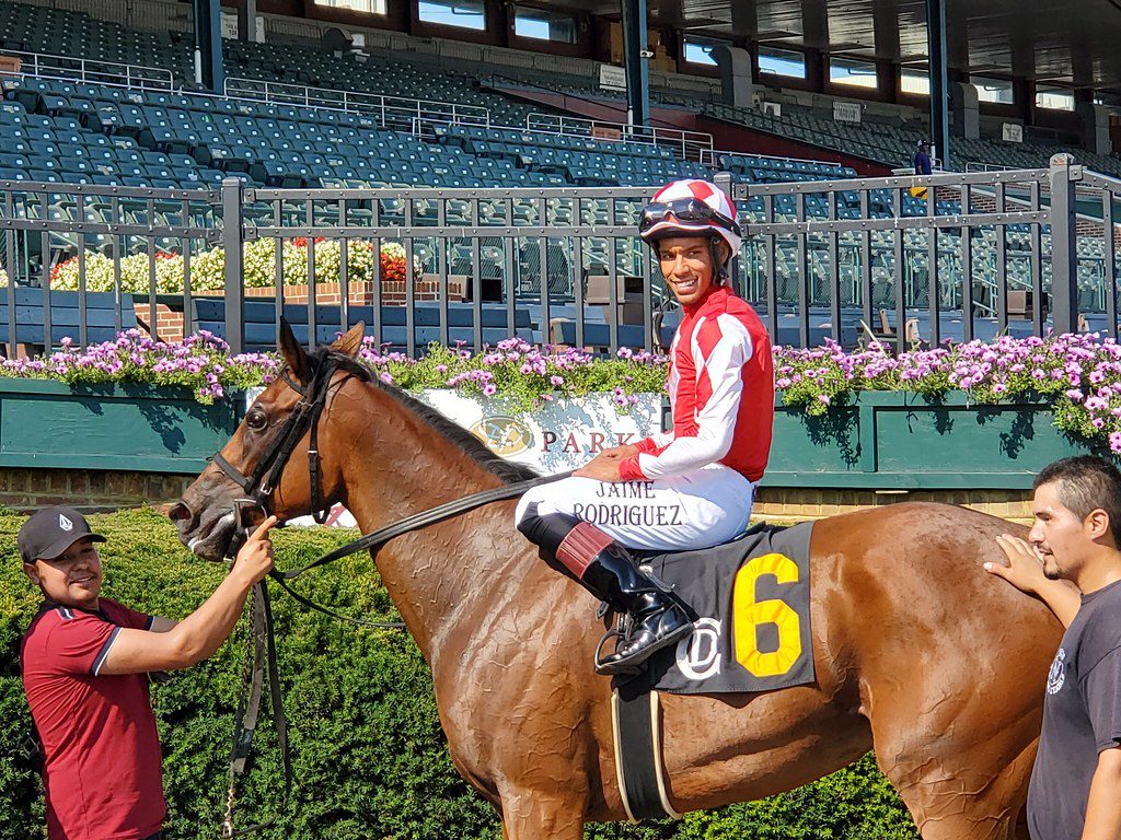 Cashing Big Checks and jockey Jaime Rodriguez won the Blue Hen Stakes. Photo Mike Valiante.