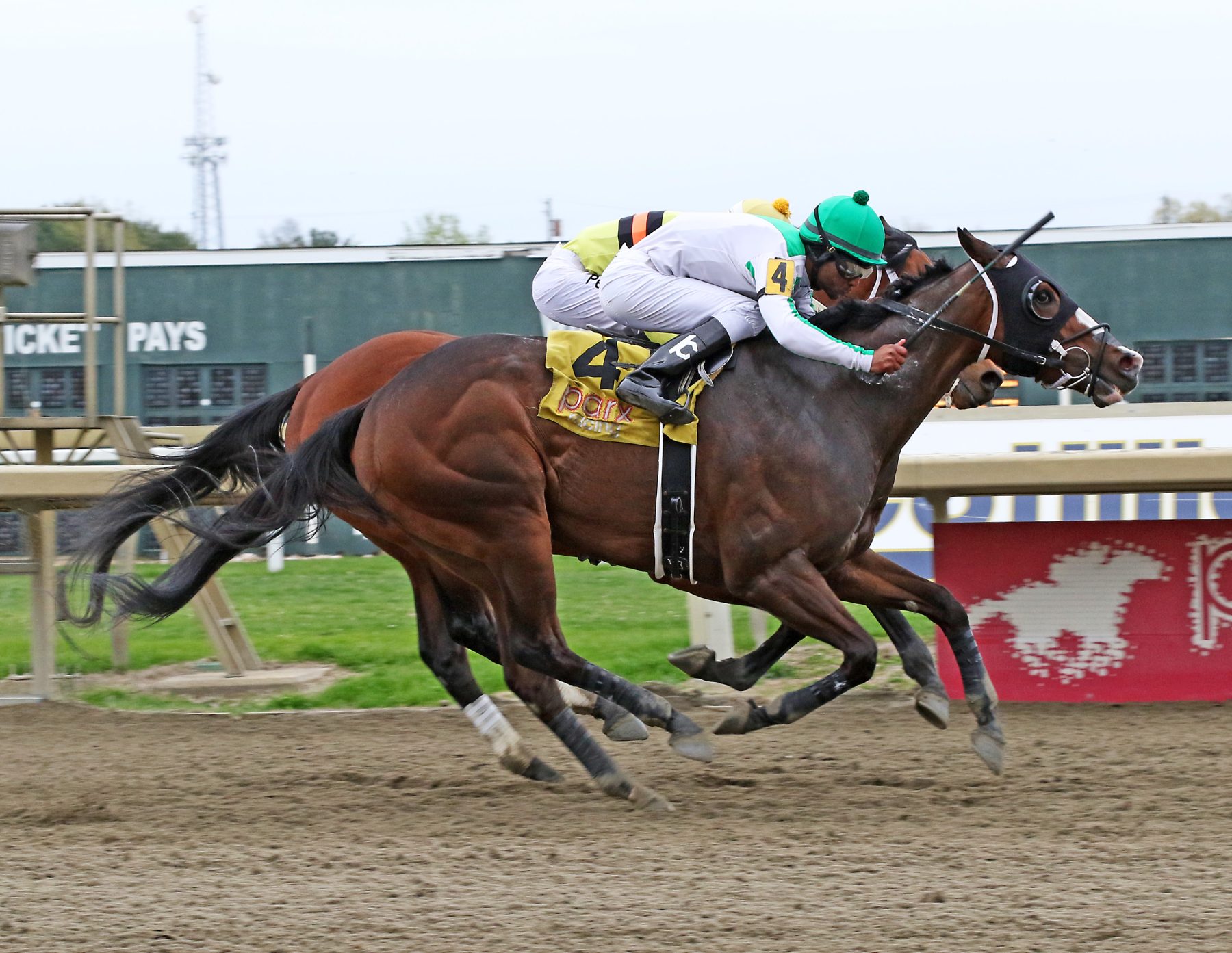 Fortheluvofbourbon #4 ridden by Kendrick Carmouche battles to the wire in the $100,000 Page McKenney Handicap at Parx Racing in Bensalem, PA on April 25, 2022. Finishing second was Beren #2. Fortheluvofbourbon is trained by Michael Pino for Smart Angle LLP. Photo by Barbara Weidl/EQUI-PHOTO.