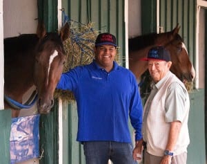 Social Inclusion, Ron Sanchez, and Manny Azpurua smile for the camera.  Photo by Jim McCue, Maryland Jockey Club.